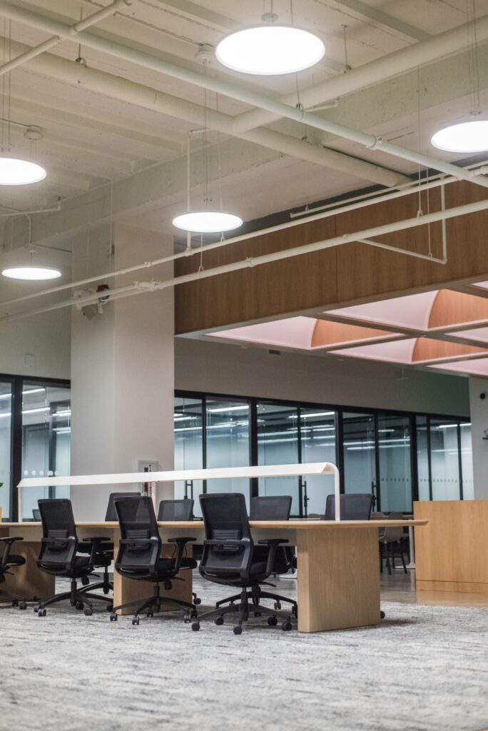 Professional office set up with wooden desks in a bench arrangement