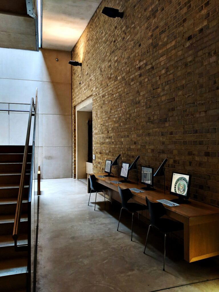 Shared workspace with solid work tables for space saving. Great for team collaboration and project-based work.